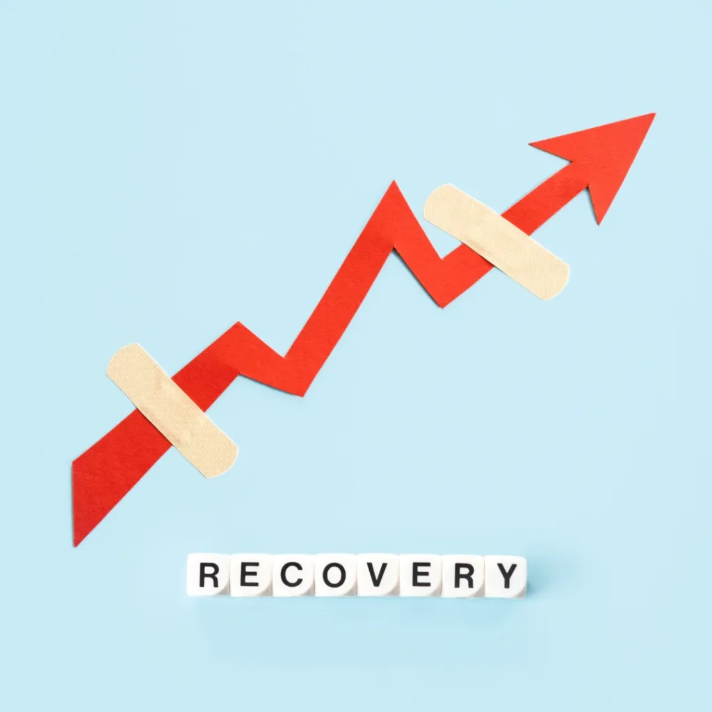 An upward trend arrow graphic with bandaids and blocks spelling RECOVERY, illustrating the benefits of using a recovery stack.