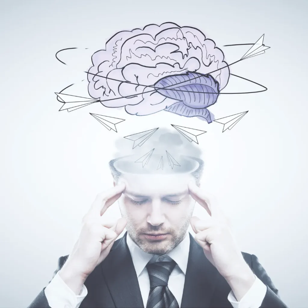 A man in deep concentration, with an illustrative drawing of a brain and paper airplanes orbiting his head, symbolizing mental focus and the active process of brain retraining for pain.