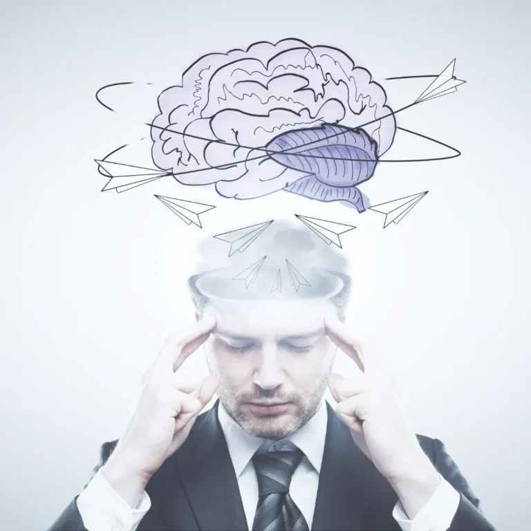 A man in deep concentration, with an illustrative drawing of a brain and paper airplanes orbiting his head, symbolizing mental focus and the active process of brain retraining for pain.
