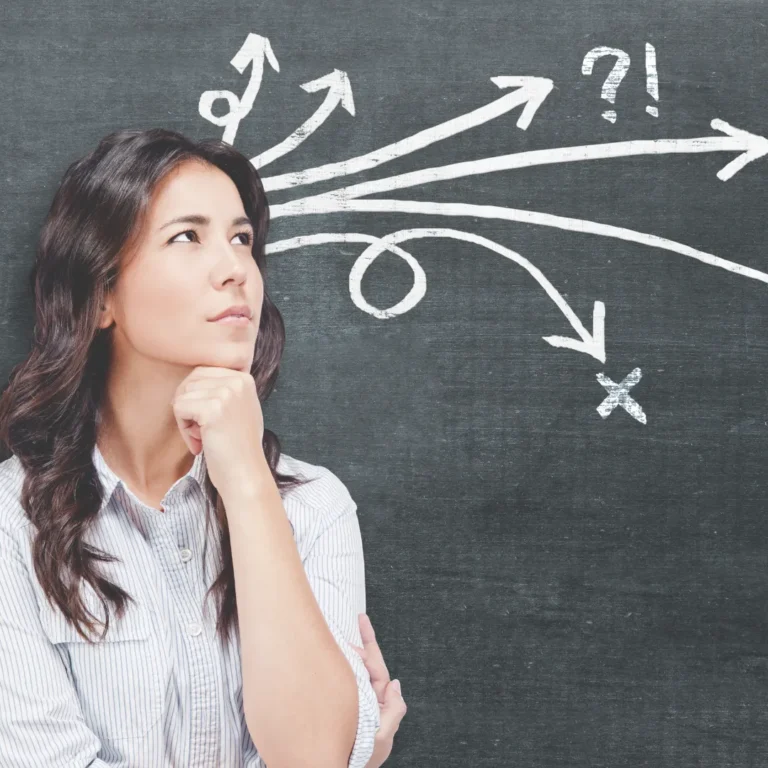 A woman looking thoughtfully at a chalkboard with multiple branching arrows and question marks, symbolizing the complexity of daily decision-making.