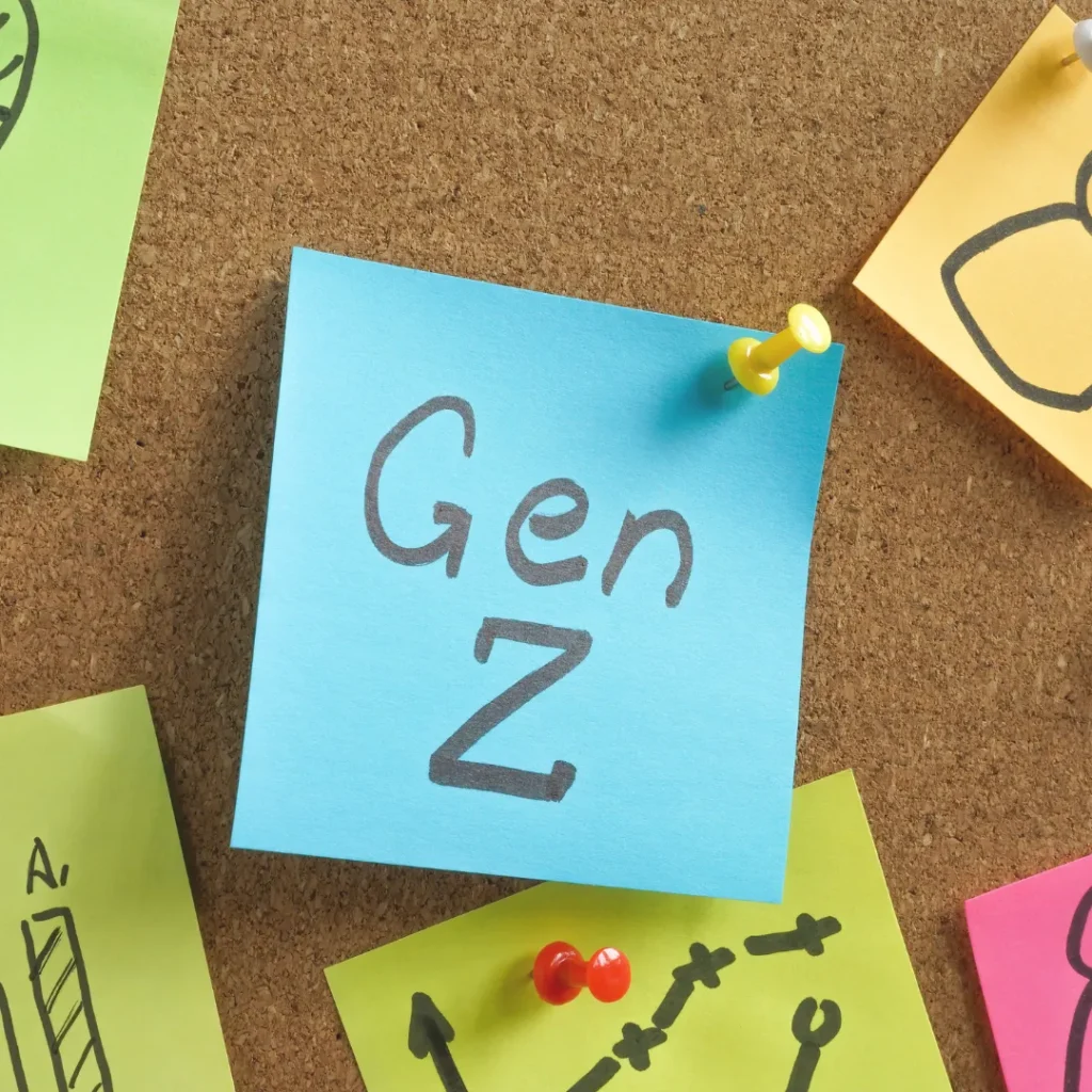 A blue sticky note with the text "Gen Z" pinned to a corkboard, symbolizing the article's focus on Gen Z using ChatGPT trends.