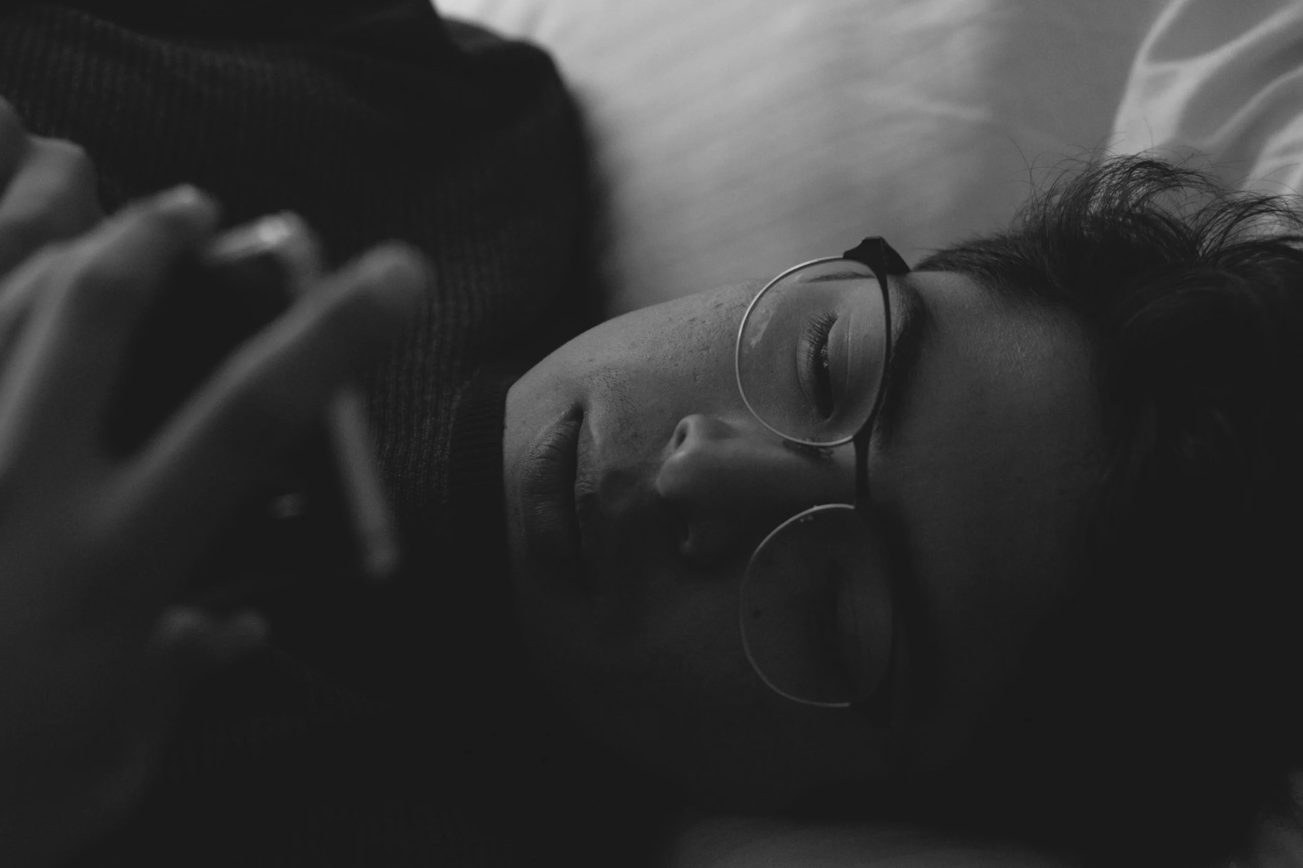 Person resting peacefully, representing nervous system recovery from micro-stressors.