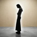 A silhouette of a woman holding her stomach under strain, representing how stress and digestive issues manifest physically in the body.