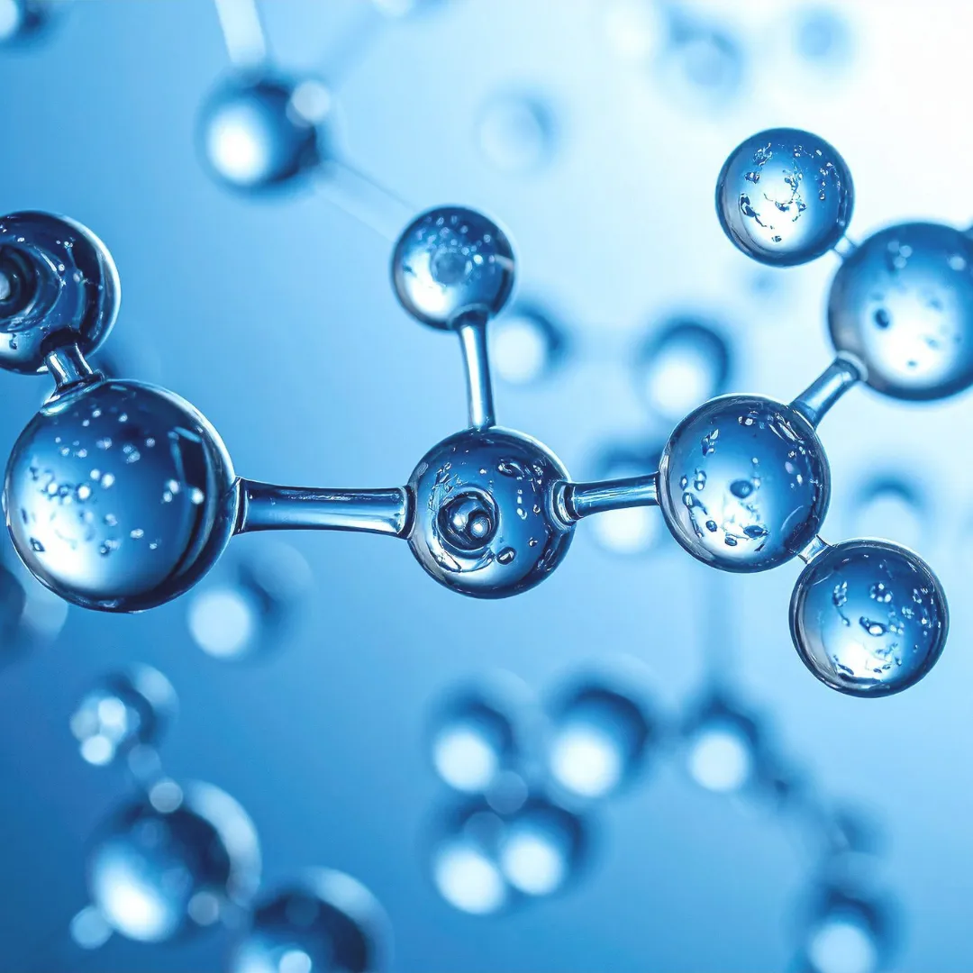 A 3D macro rendering of water molecules connected in a structured lattice, illustrating the concept of molecular coherence and hydrogen bonding.